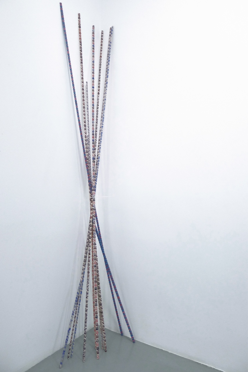 Mikado, 2015, Wood, hand-stamped masking tape and security loop tie, 250 x 43 cm