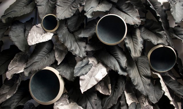 Shadow cliffs and eight ecliptic full moons, 2016-2017, depictions of the shaded side of leaves with black silk paper and printed drawings, dimensions variable