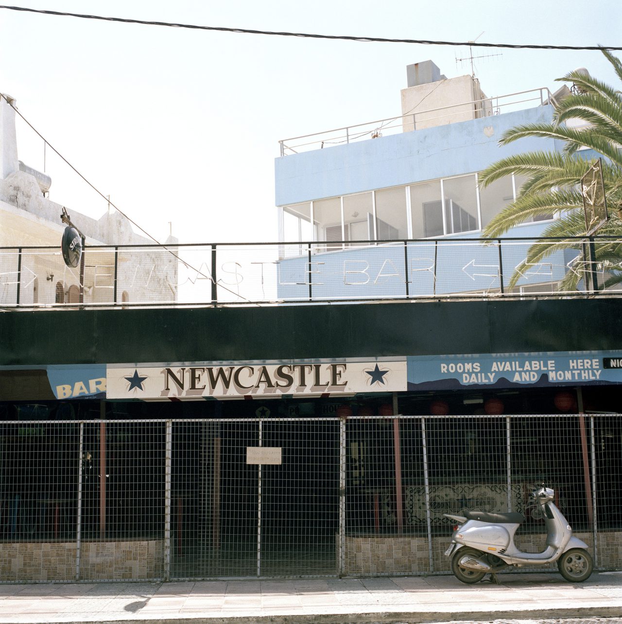 Angela Svoronou, A Scooter in Newcastle, inkjet print mounted on perspex, 30 x 30 cm, edition 1/3 + 2ap 		
